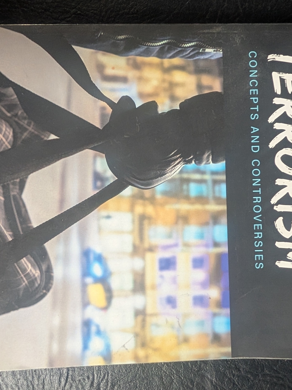Terrorism: Concepts and Controversies Paperback — Black and Teal Cover
